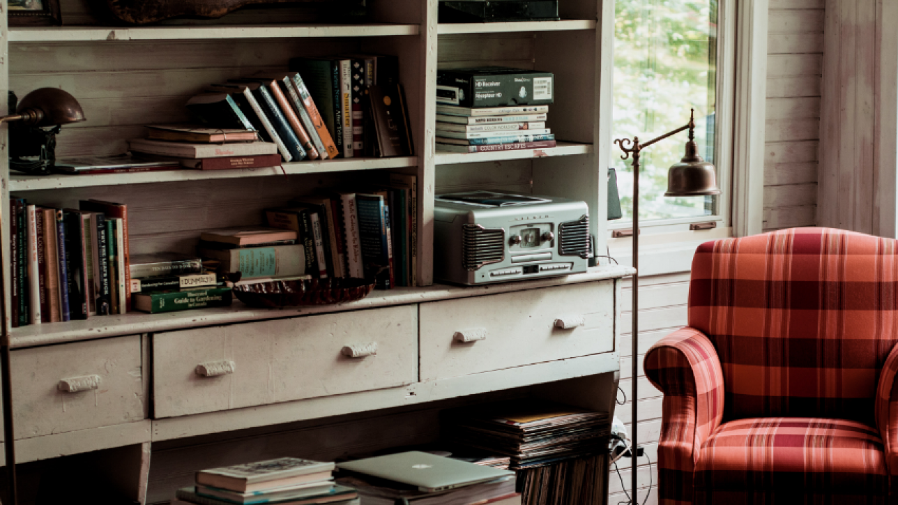 Items on bookshelf with Chair