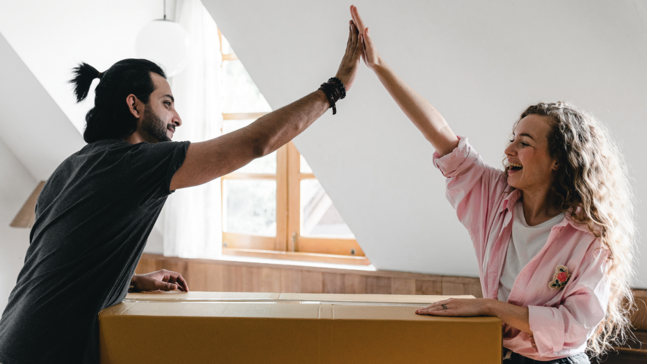 Man and woman high 5